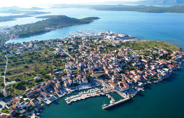 about-01 image  Aerial shot of Betina with an old harbor